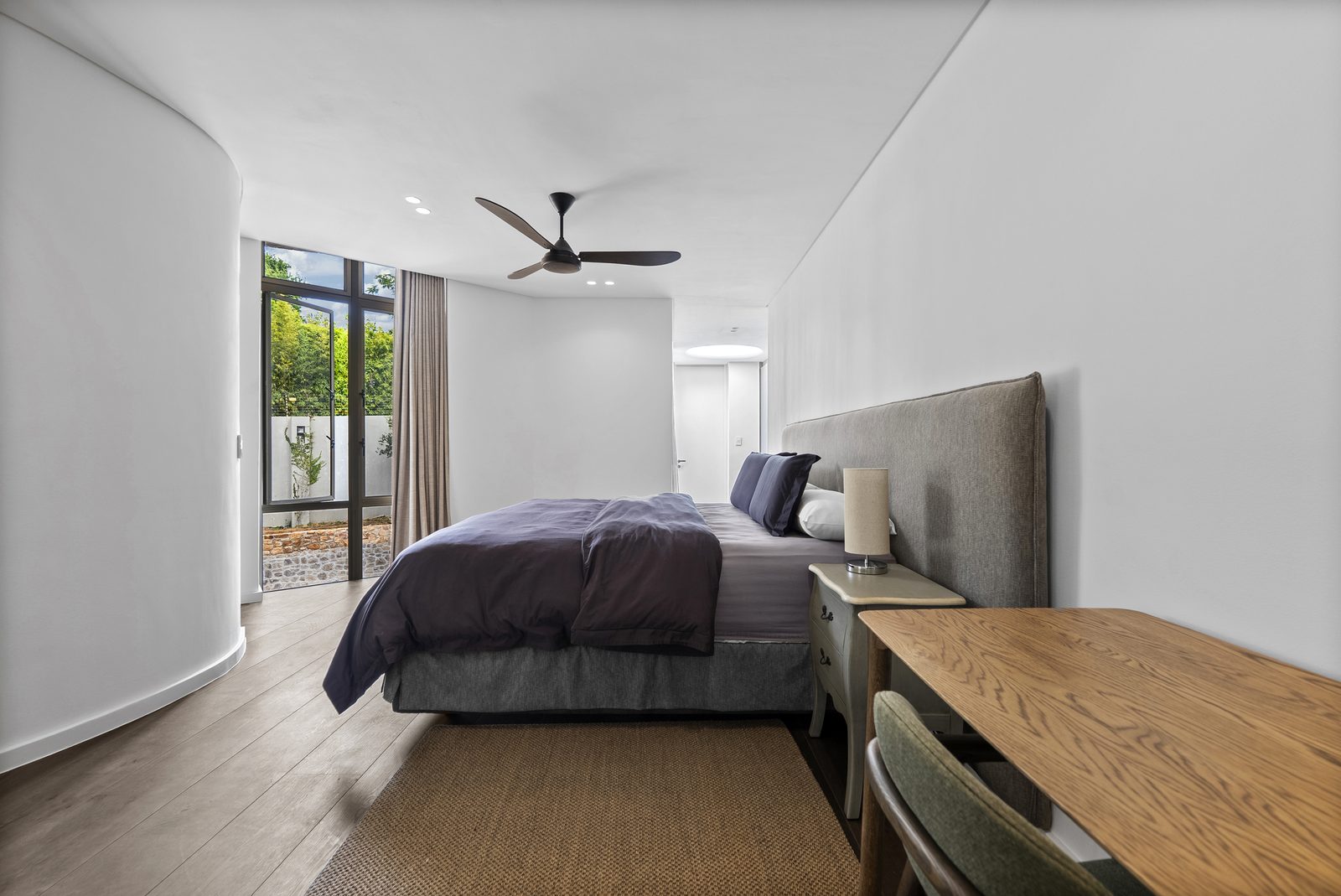 Bedroom three, with a writing desk and a garden window