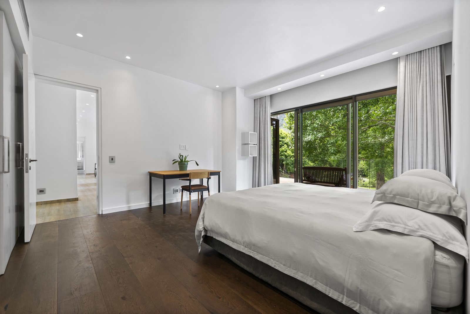 A Cottage bedroom with doors to the garden