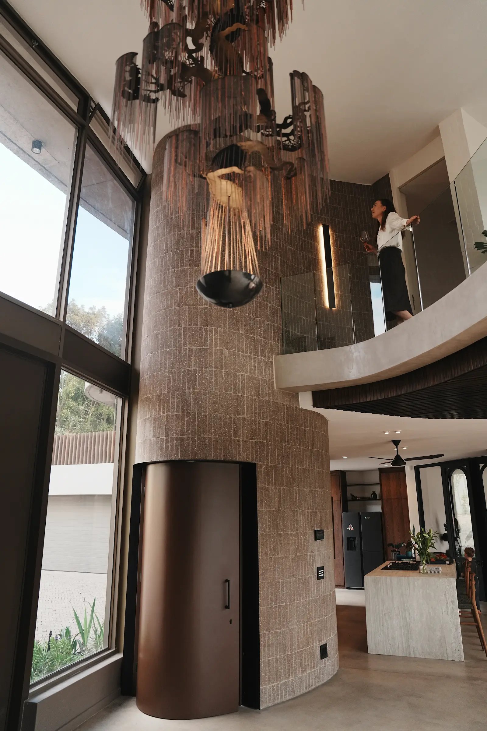 The Willowlamp chandelier over the staircase