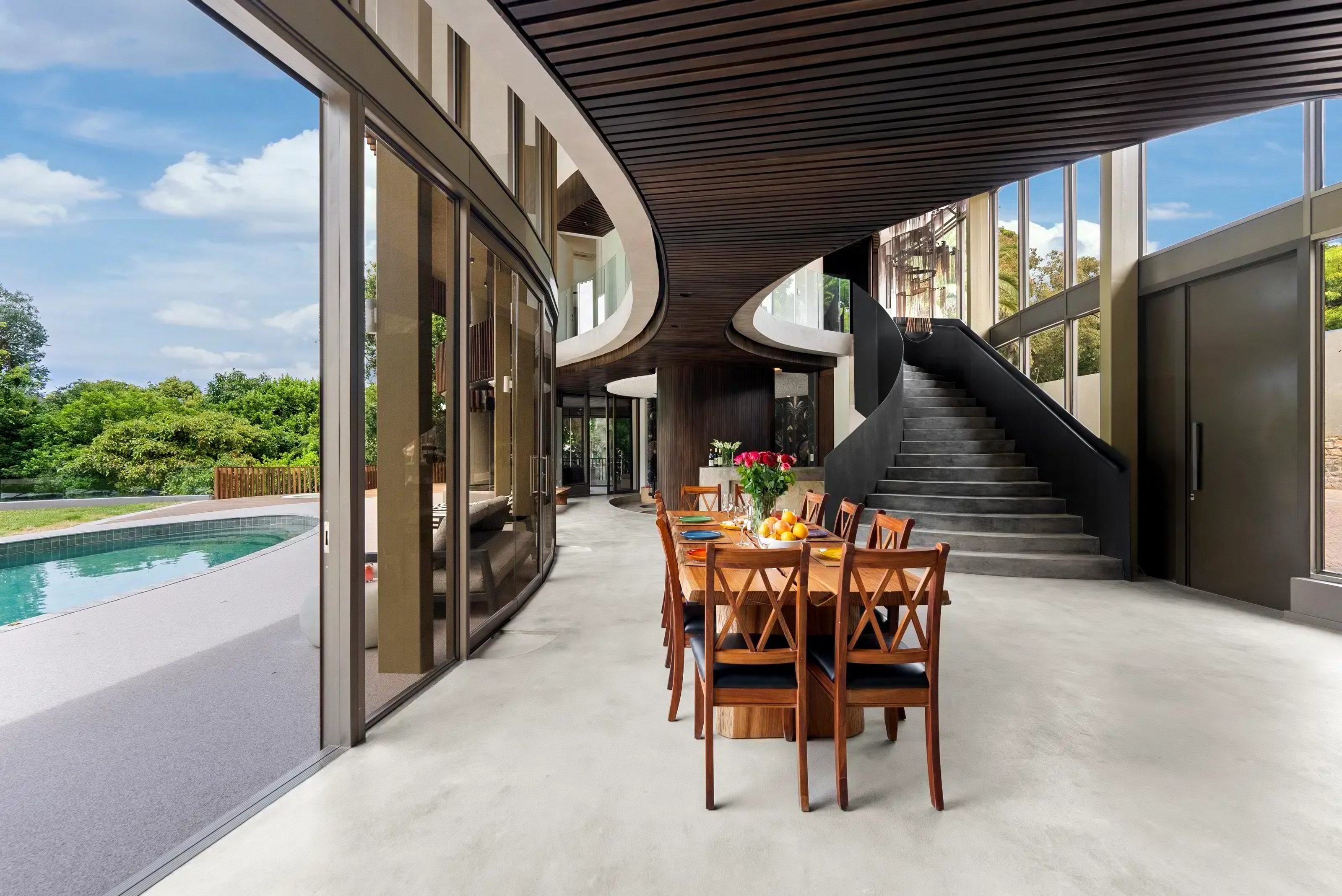 The double-volume living space opening to the pool